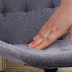 Silla de comedor Merna, tapizada en tela gris oscuro.